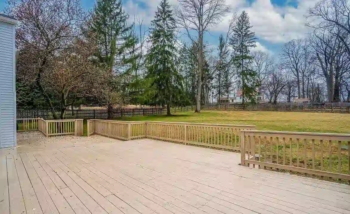 A back patio and large backyard behind a Philadelphia main line sober living home.
